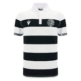 The Barbarians 25/26 Cotton Short Sleeve Home Jersey by Macron features black and white horizontal stripes, a white collar, cotton short sleeves, the Macron logo on the left chest, and a chevron on the right chest.