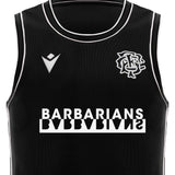 The Barbarians 25/26 Player Training Basketball Singlet by Macron is a black, sleeveless singlet with white trim, featuring the Barbarians rugby logo and "BARBARIANS" in bold white letters—ideal for training sessions.
