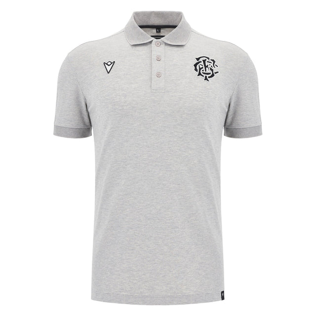 The Barbarians 25/26 Player Travel Polo by Macron is a light grey short-sleeve polo with a three-button placket, black embroidered chest logos, and a classic collar.