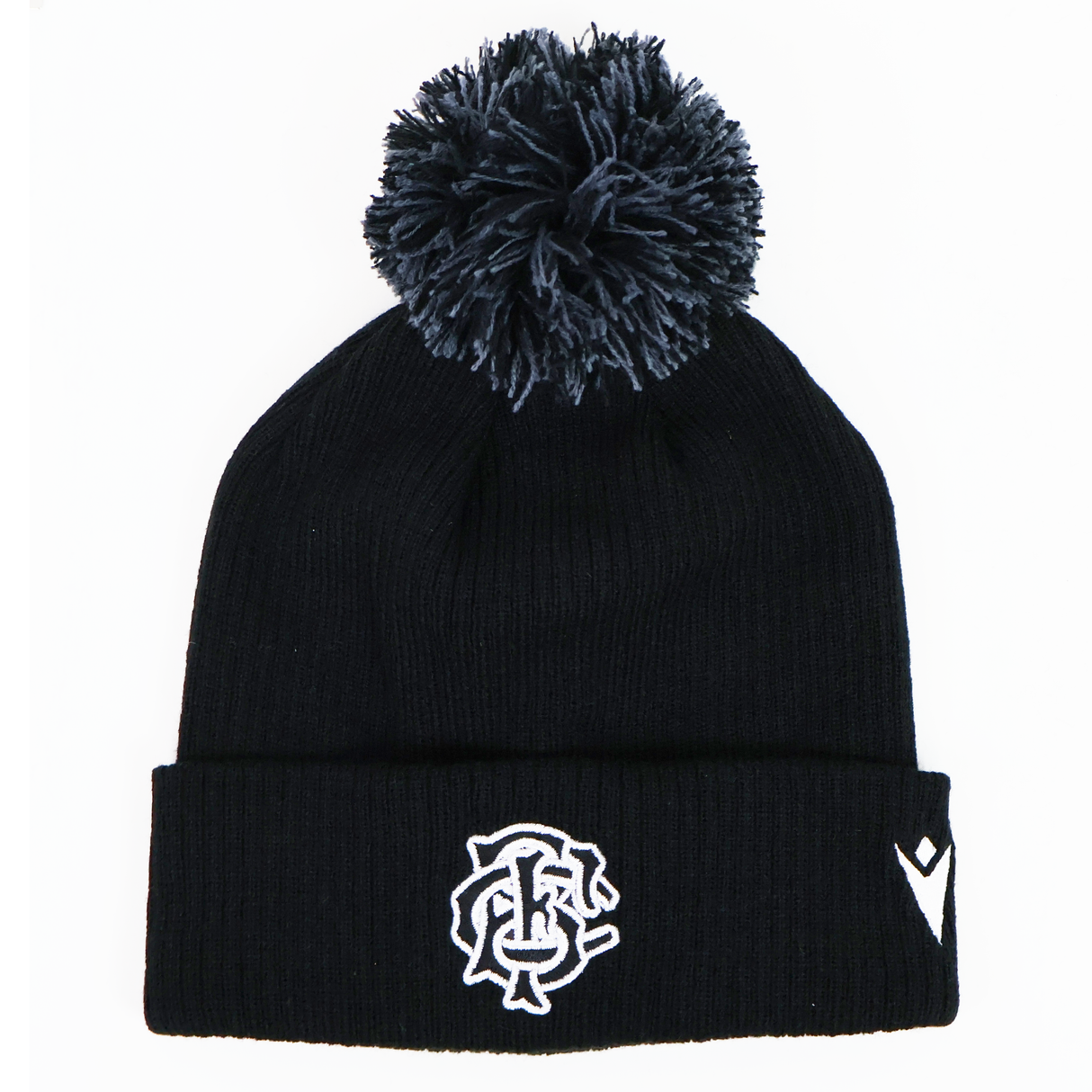 The Barbarians 25/26 Pom-Pom Beanie by Macron features a black knit design with a white embroidered monogram logo and emblem on the cuff, inspired by the classic Barbarians beanie.