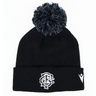 The Barbarians 25/26 Pom-Pom Beanie by Macron features a black knit design with a white embroidered monogram logo and emblem on the cuff, inspired by the classic Barbarians beanie.