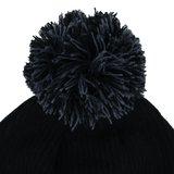 Close-up of the Barbarians 25/26 Pom-Pom Beanie by Macron, showcasing a black knit design with a large dark pom-pom on top, set against a white background.