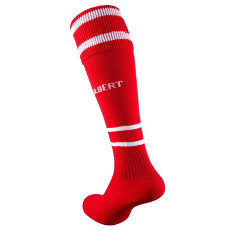 Gilbert's Training II Socks are red knee-highs with white stripes and "ALBERT" on the side. Designed with elasticated support for a secure fit, these padded socks enhance comfort during intense athletic sessions.