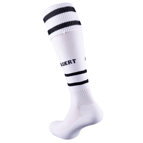 The Gilbert Training II Sock by Gilbert is a white knee-high sock with black horizontal stripes and "GILBERT" text in black, offering elasticated support and padded sections for improved comfort.