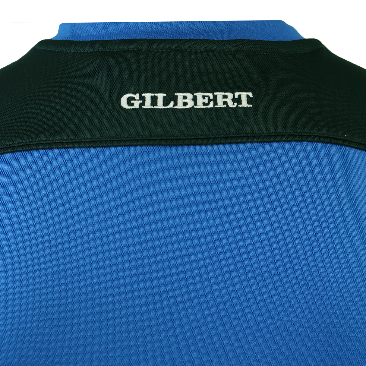 The back of the Gilbert Photon Training Tee by Gilbert, made from moisture-wicking fabric in blue and black, features "GILBERT" embroidered in white on the upper black section.