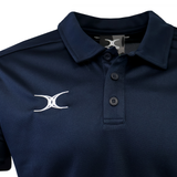 The Gilbert Photon II Polo by Gilbert is a navy blue shirt with lightweight fabric, three buttons, and a white embroidered logo on the left chest.