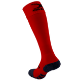 Introducing the Gilbert Pro Match Sock: a stylish red knee-high sock with a black sole and sleek logo. Crafted for comfort and performance, these socks ensure support during any activity.