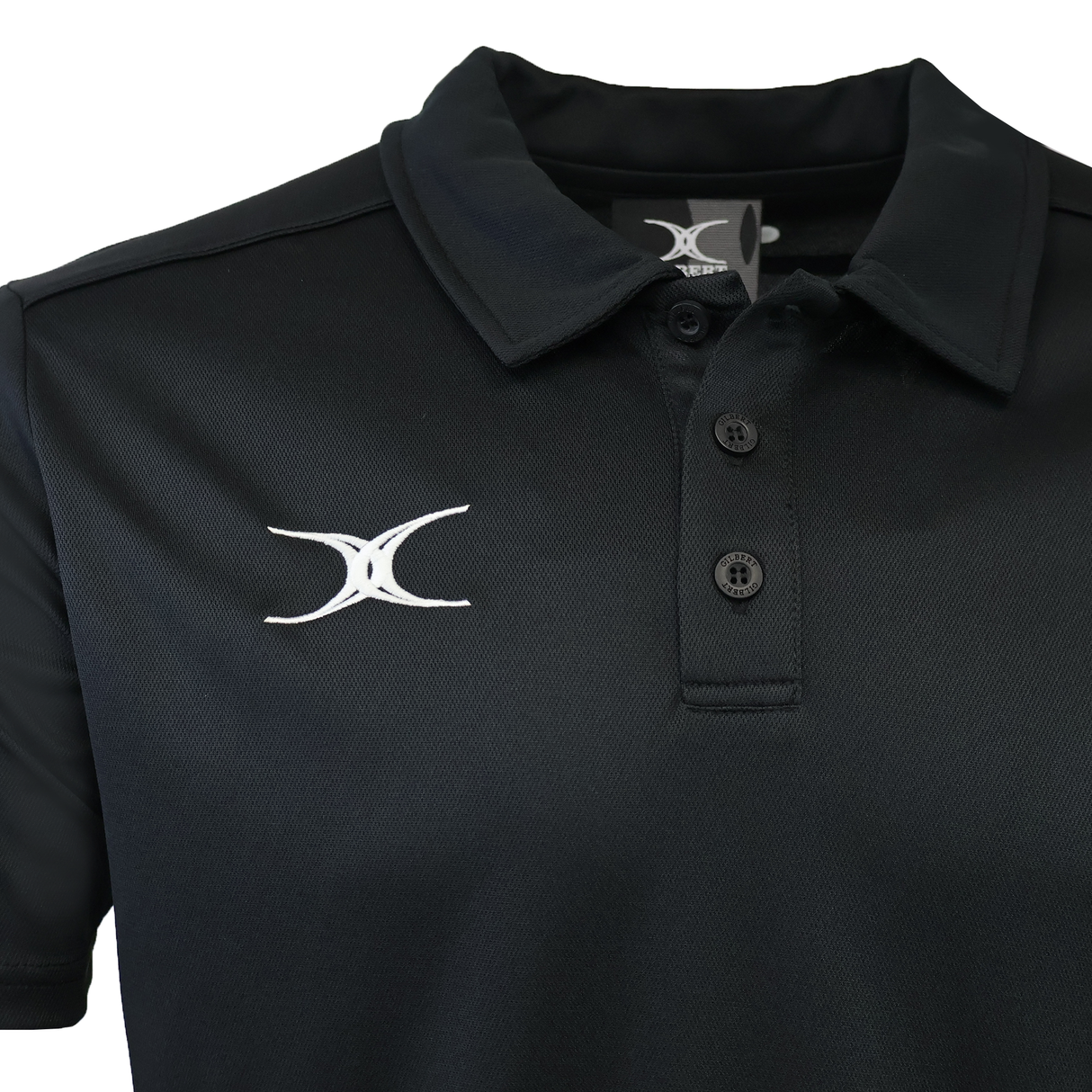 The Gilbert Photon II Polo is a black, short-sleeve collared shirt with three buttons and a white embroidered Gilbert logo on the left chest, made from lightweight, moisture-wicking fabric for all-day comfort.