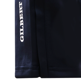 Close-up of the lower section of Gilbert GTS Training Pants by Gilbert, featuring "GILBERT" printed vertically in white text on the left side.