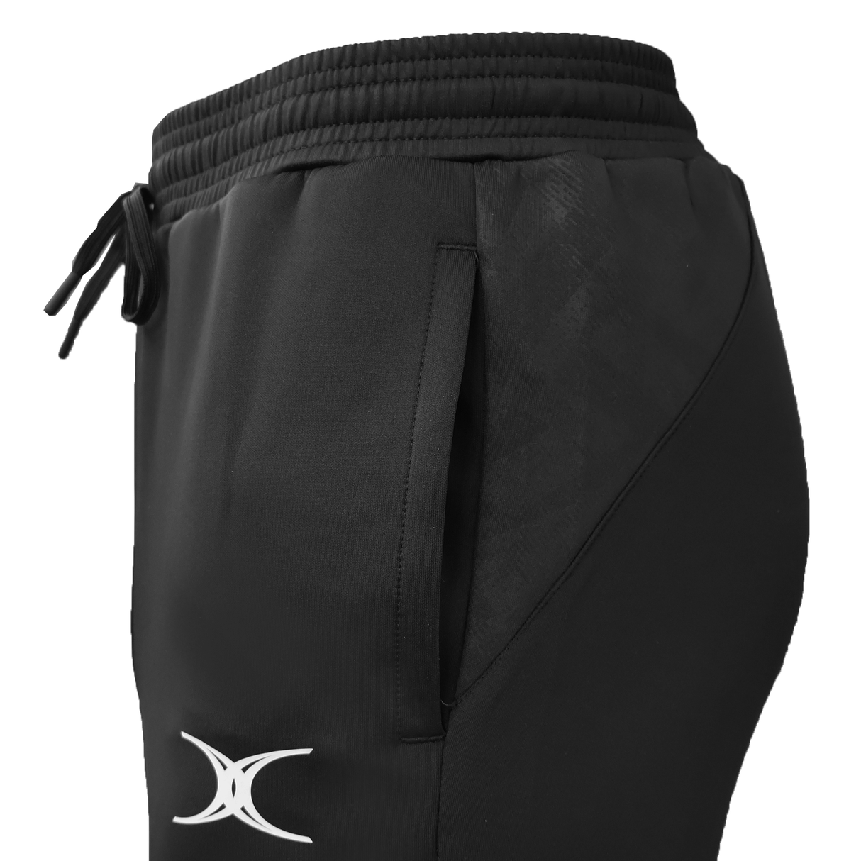 Close-up of black Gilbert GTS Training Pants by Gilbert, featuring a white logo near the pocket, elastic waistband, and drawstring—ideal for rugby training sessions.