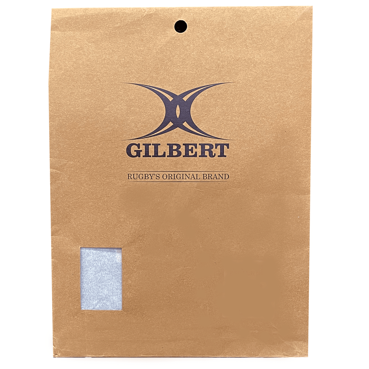 A brown paper bag with the "Gilbert" logo, a rugby brand celebrating Rugby's 200 Year Anniversary, along with "Rugby's Original Brand" text. The bag has a small transparent window near the bottom left corner containing the Gilbert Rugby 200 Year Anniversary Leisure Shirt by Gilbert.