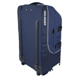 Dark blue rolling suitcase with the brand name "Gilbert" printed on the side. The Gilbert Club Tour Rugby Travel Bag is a premium travel hold-all that features multiple compartments, two wheels, and reinforced sides.