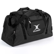 The Gilbert Club Player Holdall Duffle Bag by Gilbert features a shoulder strap, zippered compartments, and the classic Gilbert logo on the front pocket—ideal for transporting your rugby gear.