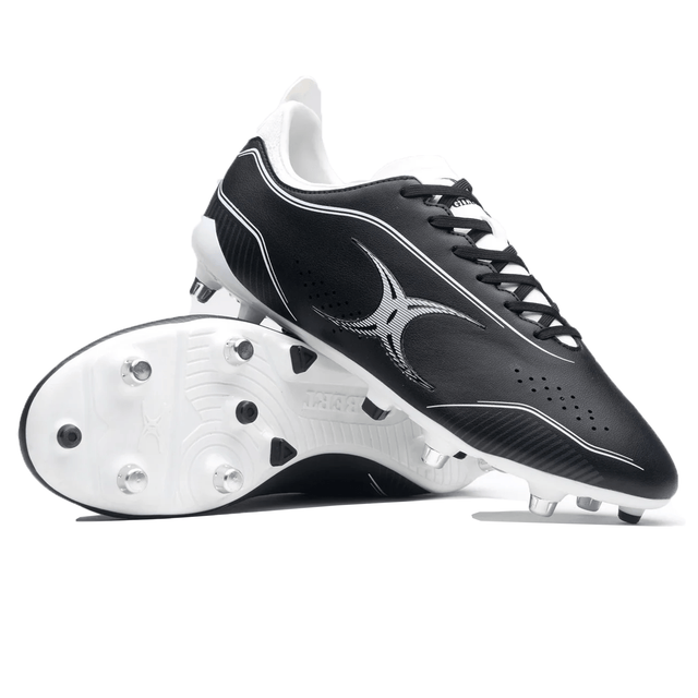 The Gilbert Cage Torq 6S SG cleats in black and white, featuring a star design and metal studs, are designed for speed and performance.