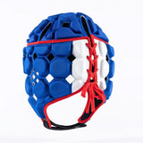 The Gilbert Octane Headguard by Gilbert is a blue padded rugby headguard with white and red accents, showcasing a honeycomb pattern and lace-up front closure. This protective headgear features EVA padding for enhanced comfort and safety, and is displayed on a plain white background.