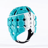 The Gilbert Octane Headguard by Gilbert features blue and white padding with hexagonal patterns, white laces on the side, and a chin strap for a custom fit and protective comfort, displayed against a plain white background.