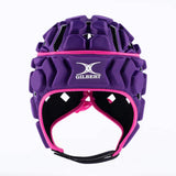 A Gilbert Octane Headguard in purple, featuring black EVA padding and pink trim for superior protection, is shown against a plain white background.