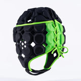 The Gilbert Octane Headguard by Gilbert is a black and green rugby headguard with a honeycomb pattern, custom fit, and protective padding. It features side laces and is displayed against a plain white background.