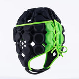 The Gilbert Octane Headguard by Gilbert is a black and green padded rugby headguard featuring hexagonal patterns, protective padding, and a lace-up side for a custom fit, displayed on a plain white background.