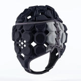 The Gilbert Octane Headguard by Gilbert is a padded black and gray rugby headguard featuring hexagonal and diamond-shaped cutouts, side lacing, and a chin strap for excellent protection. Constructed with EVA padding to enhance comfort and absorb impact, this headgear is displayed on a plain background.