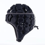 The Gilbert Octane Headguard by Gilbert is a black padded sports helmet featuring hexagonal and circular patterns, side ear protection, and adjustable chin straps, shown against a white background. This high-quality protective headgear includes EVA padding for enhanced comfort and impact absorption, making it an ideal rugby headguard.
