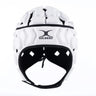 The Gilbert Octane Headguard, shown from the front against a plain white background, is a white padded rugby scrum cap featuring protective padding for enhanced safety and the Gilbert logo on the forehead—an ideal choice for rugby players.