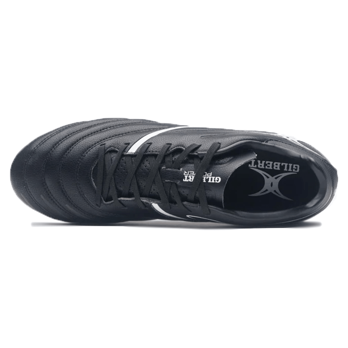 A top-view of the Gilbert Sidestep X20 8S Power SG - Black/White reveals a black athletic rugby boot with white accents, showcasing the "Gilbert" brand name on the insole, engineered for power and performance on soft ground.