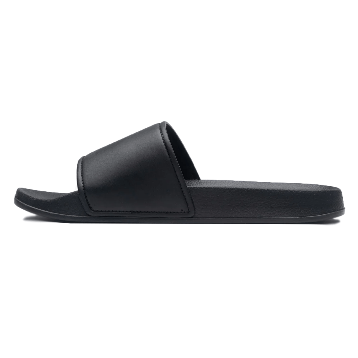 A side view of the Gilbert Slide Sandals in Black, featuring a single wide strap over the foot and a flat sole, crafted from quick-drying material.