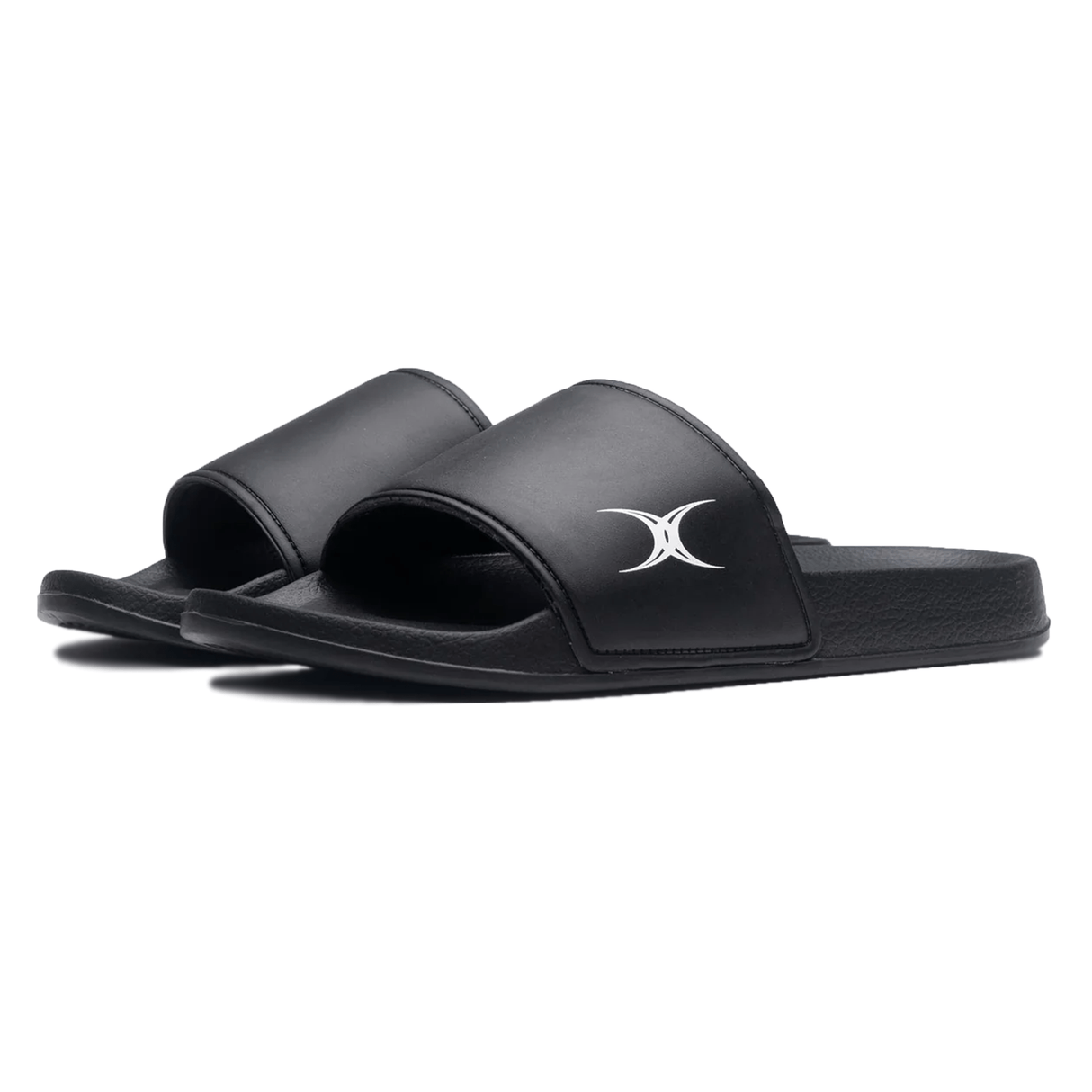 A pair of Gilbert Slide Sandals - Black, featuring plush cushioning and a white Gilbert logo on the strap.
