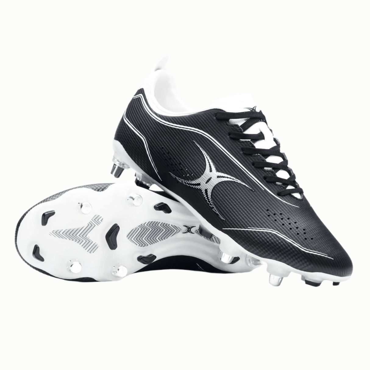 A pair of black soccer cleats with white accents and studs, showcasing a sleek design. One shoe is positioned sideways revealing the sole, while the other stands upright. These could easily rival any Gilbert Cage Pace Pro 6S SG - Black/White boots by Gilbert in terms of performance and style.
