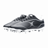 A pair of Gilbert Cage Pace Pro 6S SG soccer cleats in black and white, designed with metal studs and made from advanced materials by Gilbert, showcased on a white background.