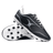 A pair of Gilbert Cage Torq MSX FG - Black/White soccer cleats is displayed, with one shoe upright and the other laid on its side showcasing a multi-surface sole ideal for various pitches.