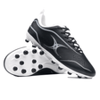 A pair of Gilbert Cage Torq MSX FG - Black/White soccer cleats is displayed, with one shoe upright and the other laid on its side showcasing a multi-surface sole ideal for various pitches.
