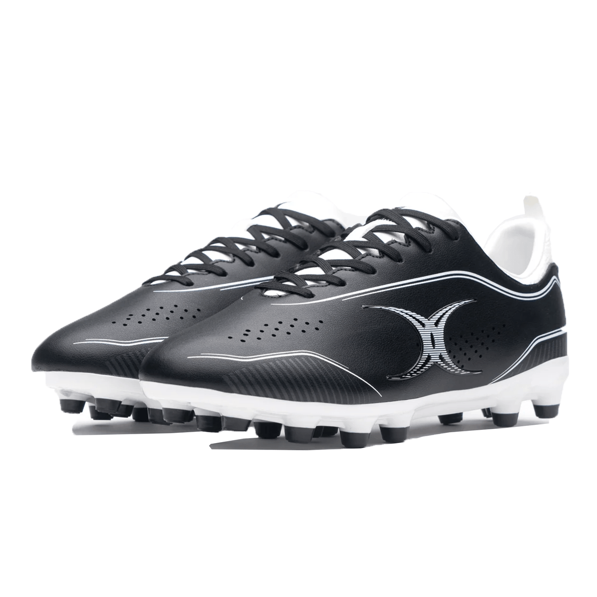 A pair of Gilbert Cage Torq MSX FG soccer cleats in black, adorned with white accents and the iconic logo on the sides, featuring a multi-surface sole with white studs.
