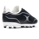 The Gilbert Cage Torq MSX FG - Black/White from Gilbert is a black soccer cleat with white accents and a large silver "X" logo on the side, featuring a white sole with studs for lightweight, multi-surface traction.
