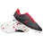 A pair of Gilbert Cage Torq 6S SG rugby boots in black and red, featuring white soles with metal studs; one boot stands upright while the other lies on its side showing the sole.