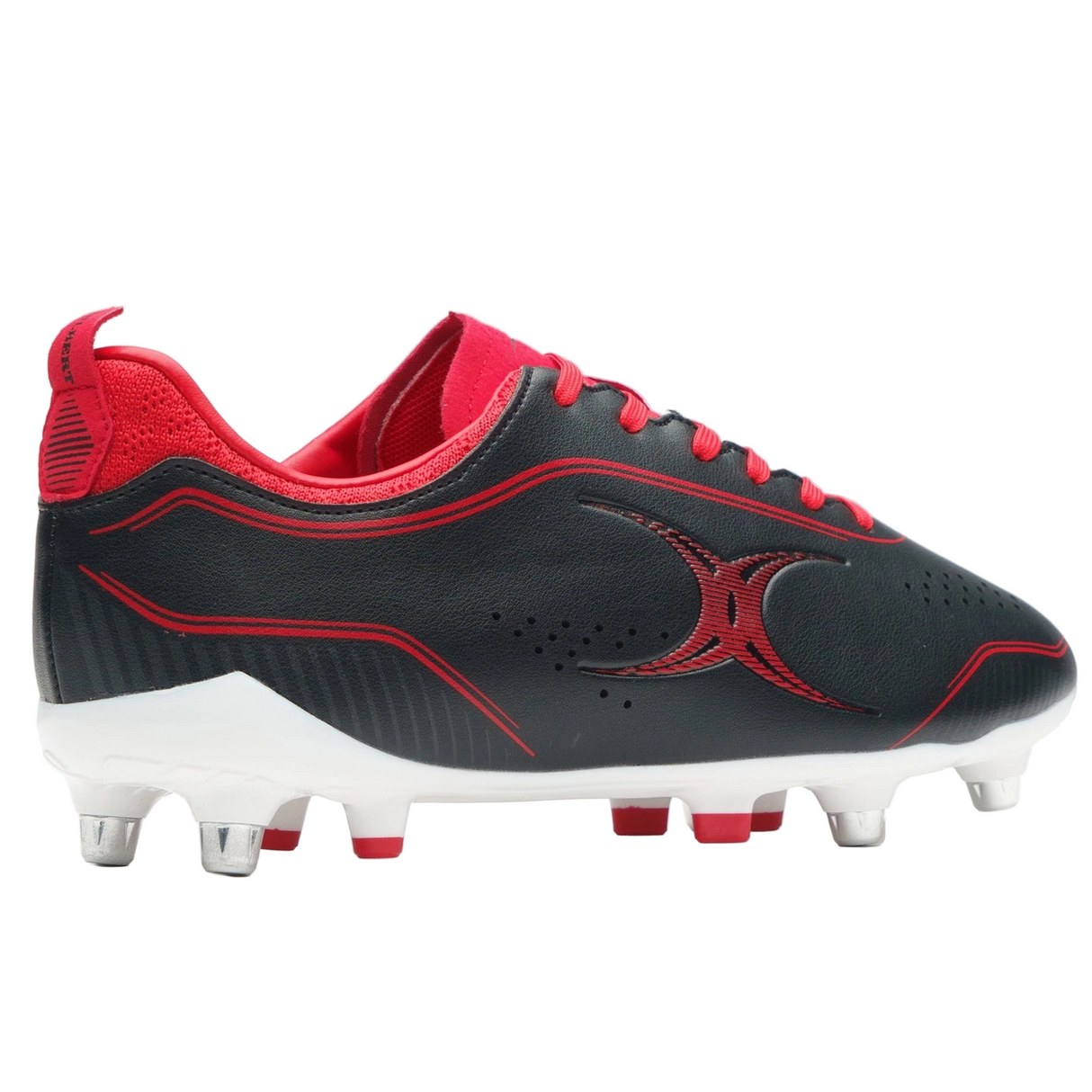The Gilbert Cage Torq 6S SG in black and red features metal studs, a geometric design, and white accents on the sole—perfect lightweight rugby boots for soft ground.