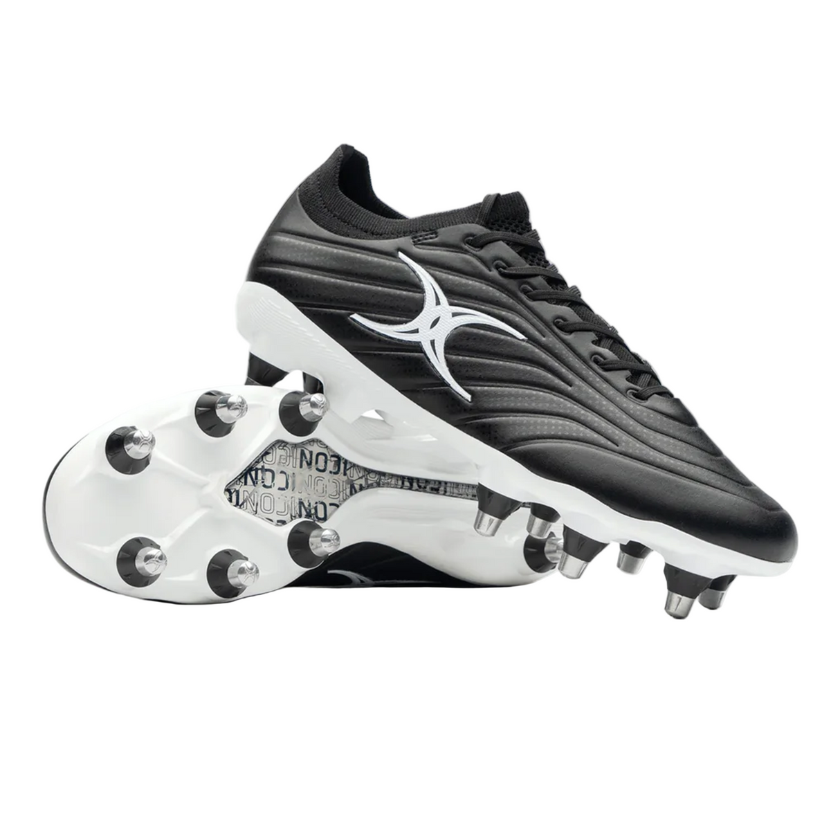 The Gilbert Icon Power 8S V2 SG rugby boots in black feature a classic black and white design with metal studs—one boot upright, one on its side to showcase the stud layout—perfect for soft ground play or scrummaging.