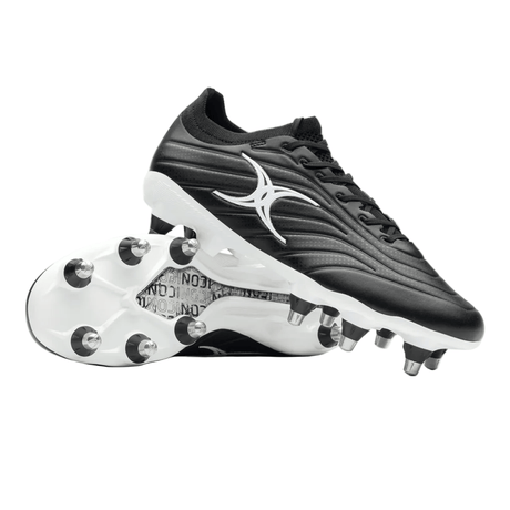 A pair of Gilbert Icon Power 8S V2 SG Rugby Boots in black, featuring metal studs—one boot upright and the other shown sole-up to highlight the stud configuration. These soft ground boots from Gilbert are ideal for scrummaging.