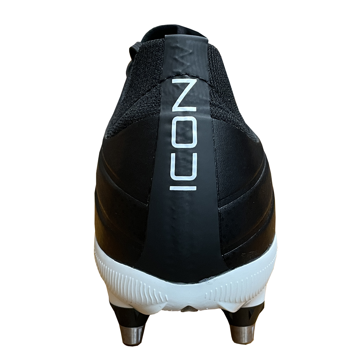 The Gilbert Icon Power 8S V2 SG rugby boot in black, shown from the back, features metal studs for scrummaging and has "ICON" printed vertically on the heel.