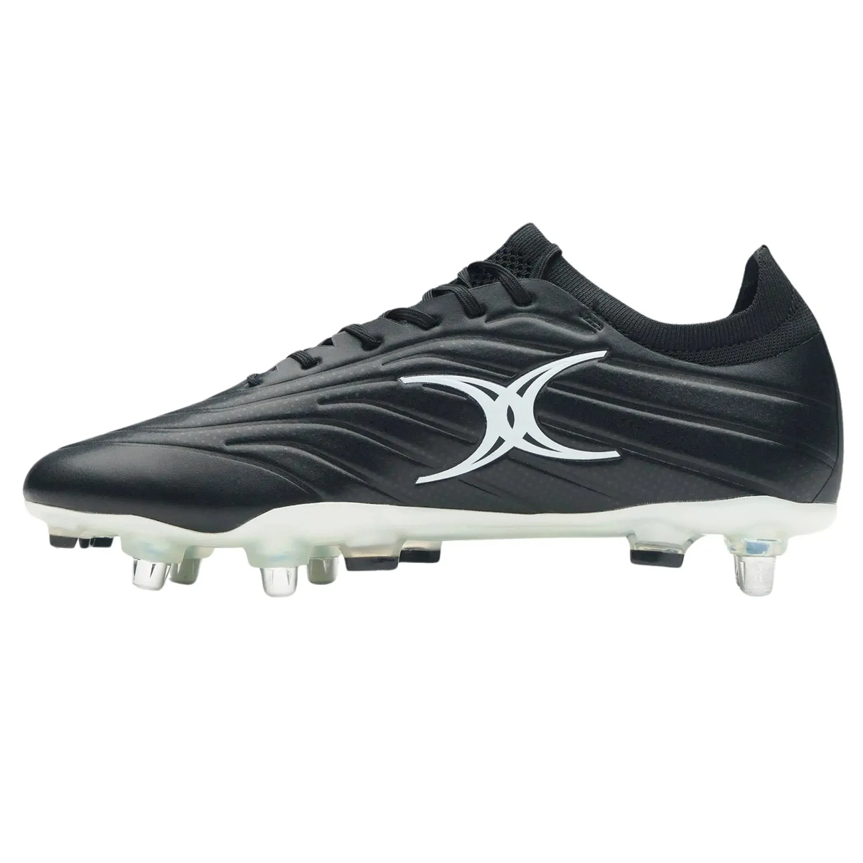 The Gilbert Icon X 6S SG - Black by Gilbert is a black soft ground soccer cleat with white accents, studs, and a large white logo on the side.