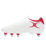 The Gilbert Icon Players 8S - White rugby boot by Gilbert, featuring red accents, a red logo, and eight metal studs for forwards, is displayed against a plain white background.