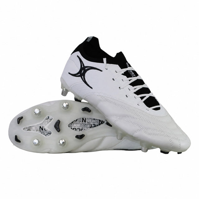 A pair of Gilbert Icon Players 2.0 6S rugby boots in white with black accents and metal studs, one boot displayed upright and the other on its side showcasing the sole.