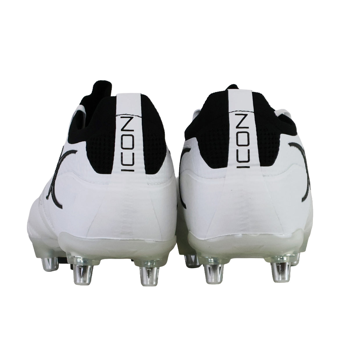 Rear view of a pair of white and black Gilbert Icon Players 2.0 6S rugby boots with metal studs, featuring the word “ICON” vertically on the back heel tabs.