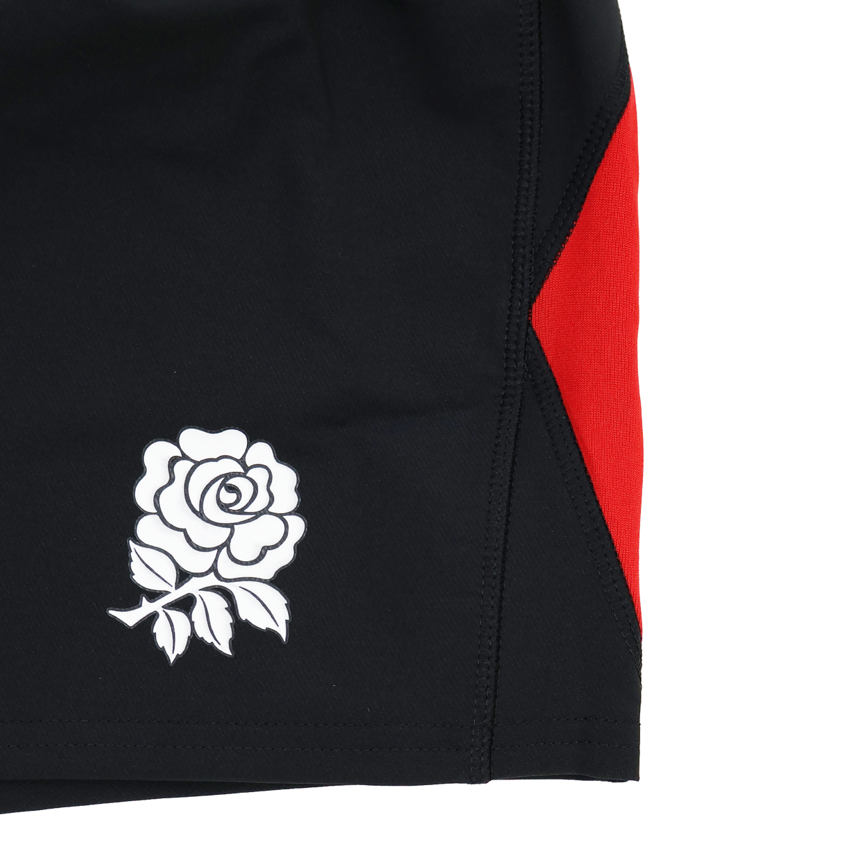 Close-up of the England Contact Training Short 24/25 by Umbro for Castore, featuring a black design with a white rose emblem and bold red side panel—ideal for intense contact training.