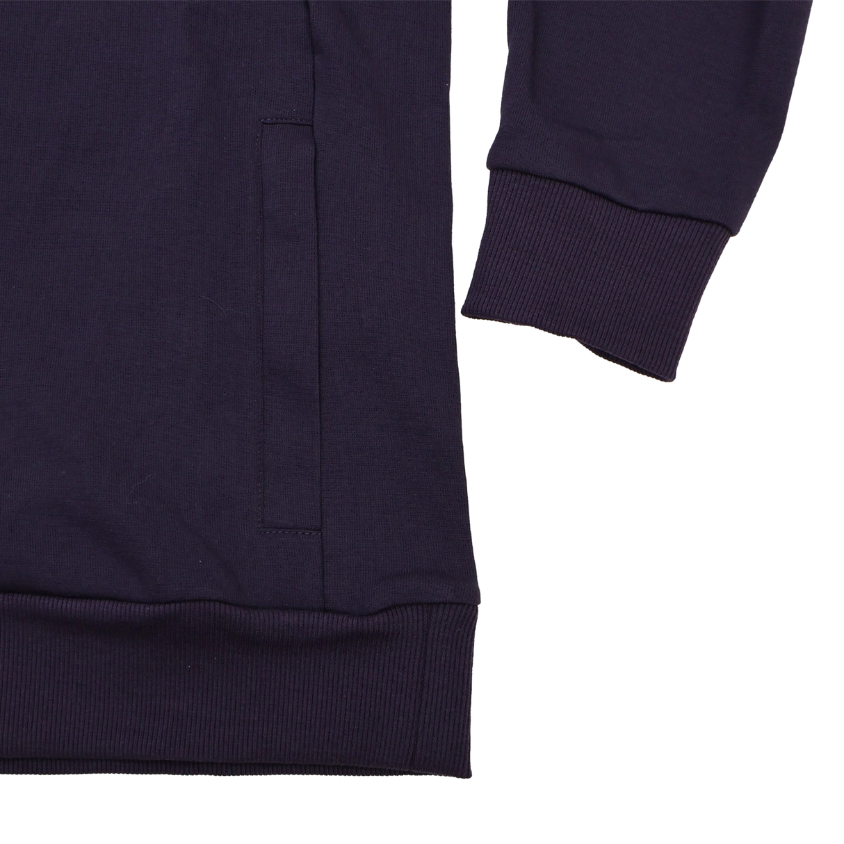 Close-up of the lower sleeve and pocket area on the Women’s England Presentation OH Hoodie 24/25 by Umbro, featuring ribbed cuffs and hem—details that showcase Castore’s quality craftsmanship.