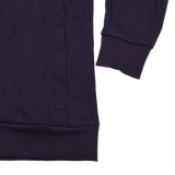 Close-up of the lower sleeve and pocket area on the Women’s England Presentation OH Hoodie 24/25 by Umbro, featuring ribbed cuffs and hem—details that showcase Castore’s quality craftsmanship.