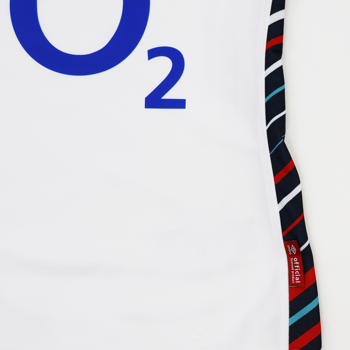 Close-up of the Women's England Home Replica Jersey 24/25 by Umbro from Castore, a white rugby jersey with a bold blue "O2" logo and side panel featuring red, black, white, and teal diagonal stripes.