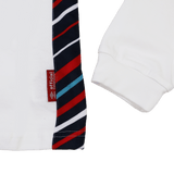Close-up of the Women's England 24/25 Home Classic LS Jersey by Umbro, highlighting its classic long sleeves, white sleeve detail, red "official" tag, and a panel with diagonal red, black, and blue stripes.