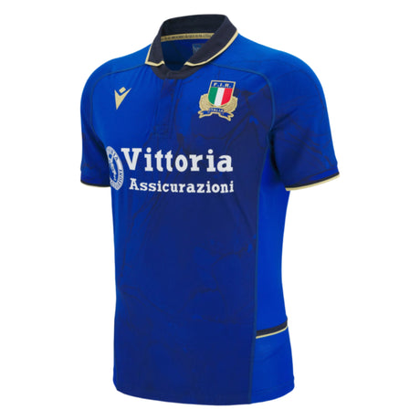 The Italy 25/26 Authentic Home Jersey by Macron features a classic collar, Italian Rugby Federation crest, and "Vittoria Assicurazioni" sponsor—ideal for true fans.